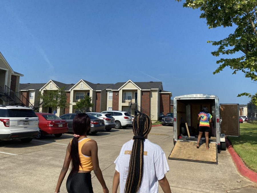 Tana Gray (left), Yoland Bellard (middle) and Alicia Waterstract (right) start moving in for a new year at Northwestern State University of Louisiana.