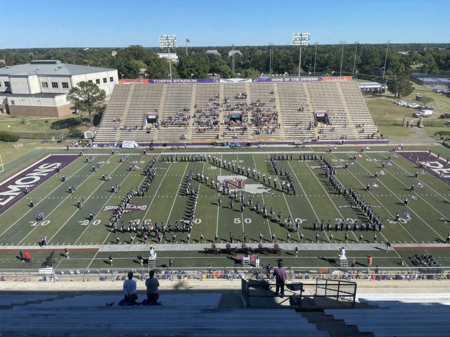 Students enjoy a full NSU football gameday experience, including the Spirit of Northwestern Marching Band in their pregame and halftime shows, as well as performing in the away side stands during the game.
