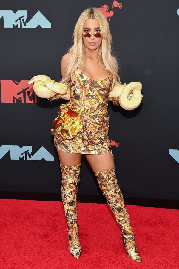 Well-known influencer Tana Mongeau walking the red carpet at the 2019 VMAs.