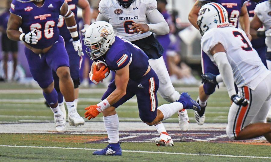 Gavin+Landry%2C+wide+receiver+for+Northwestern+State+University+of+Louisiana%2C+breaks+through+tackles+and+edges+a+first+down+against+the+University+of+Tennessee+at+Martin.
