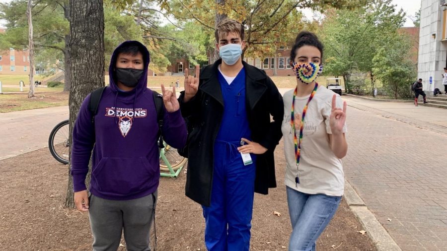 Kirk Ybanez, Esteban Garcia and Mary Fletcher masking up on campus.