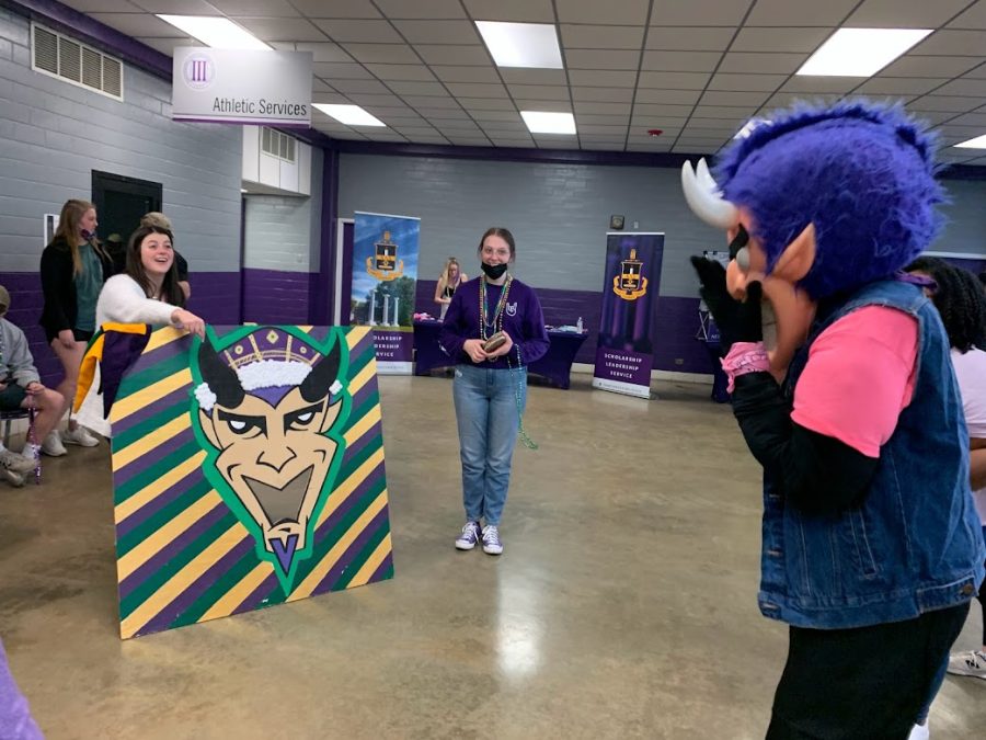 Vic the Demon came out to celebrate the festivities at Krewe of Northwestern State University of Louisiana. (L-R) Zoe Johnson, Jessica Mullican, Vic the Demon