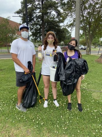 Northwestern State University of Louisiana students Landon Stephens, Maddy Hensley and Jaz Rasouliyan picked up trash on campus during the university’s annual V.L. Roy Day of Service.