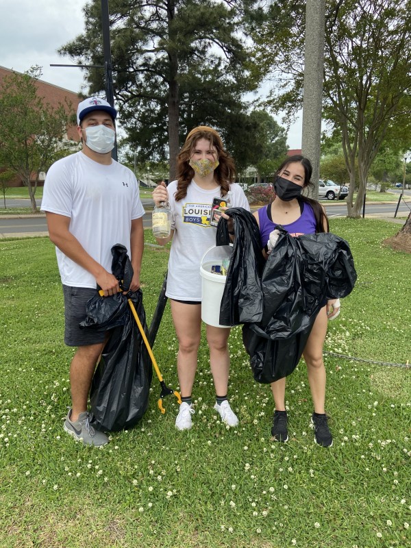 Northwestern+State+University+of+Louisiana+students+Landon+Stephens%2C+Maddy+Hensley+and+Jaz+Rasouliyan+picked+up+trash+on+campus+during+the+university%E2%80%99s+annual+V.L.+Roy+Day+of+Service.