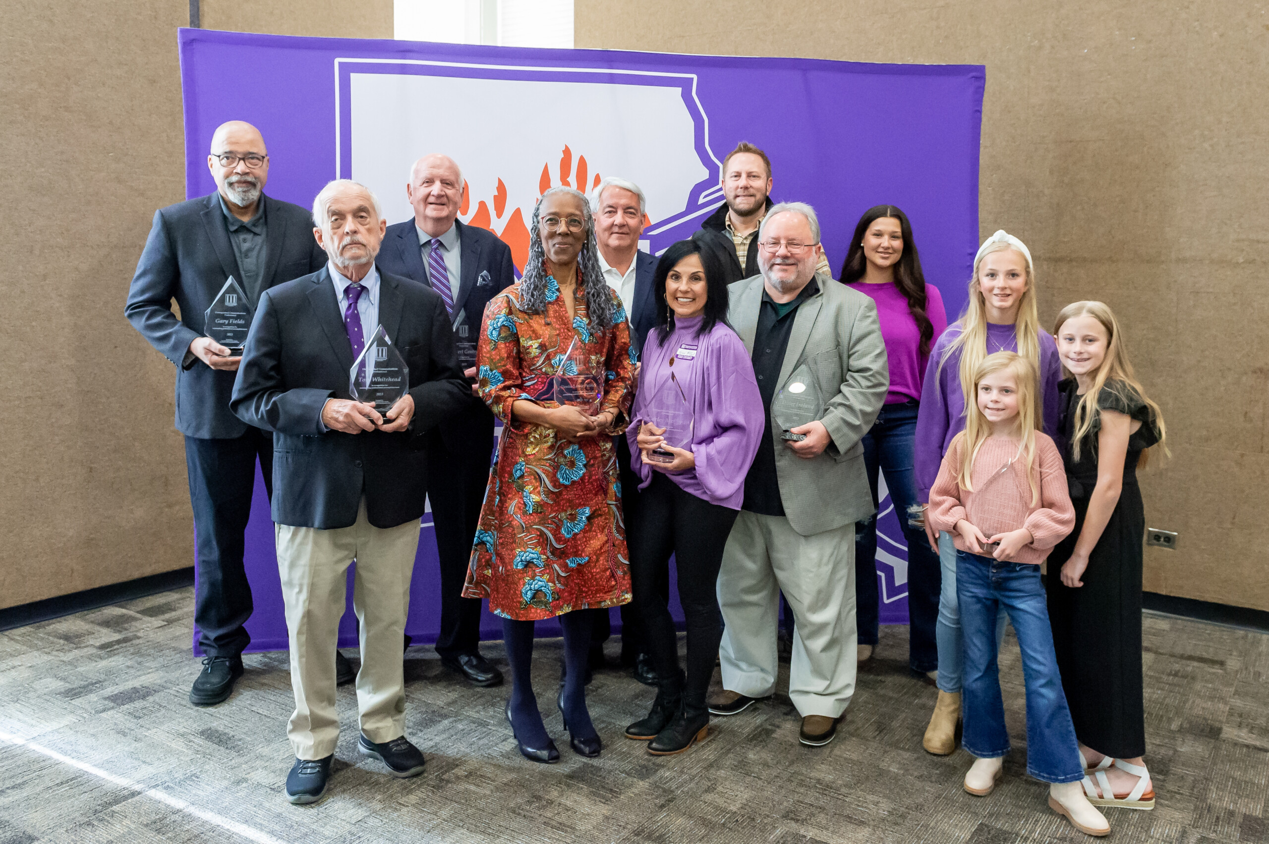 (L-R) Gary Fields, Tom Whitehead, Robert Gentry, Denise Lewis Patrick, Dan McDonald, Karen McCord, Keith Ducote, Doug Ireland, Karmelya, Ava, Charlee Ann and Allie Ducote.