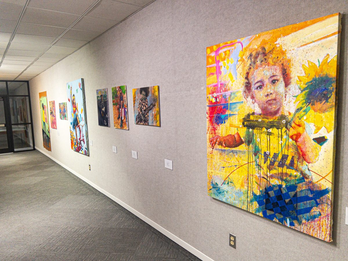 Ayo Scotts vivid and youthful acrylic paintings are among the many works featured in the Elemental Threads exhibition.