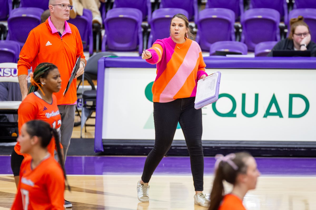 NSU associate head coach Stacey Aldredge passionately coaches the Lady Demons volleyball team from the sidelines.