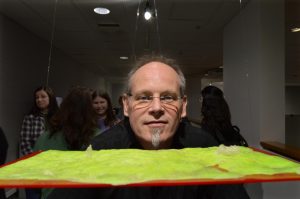 L. Collier Hyams and his piece, "Man Thinks He's God, But I Don't Know About That."