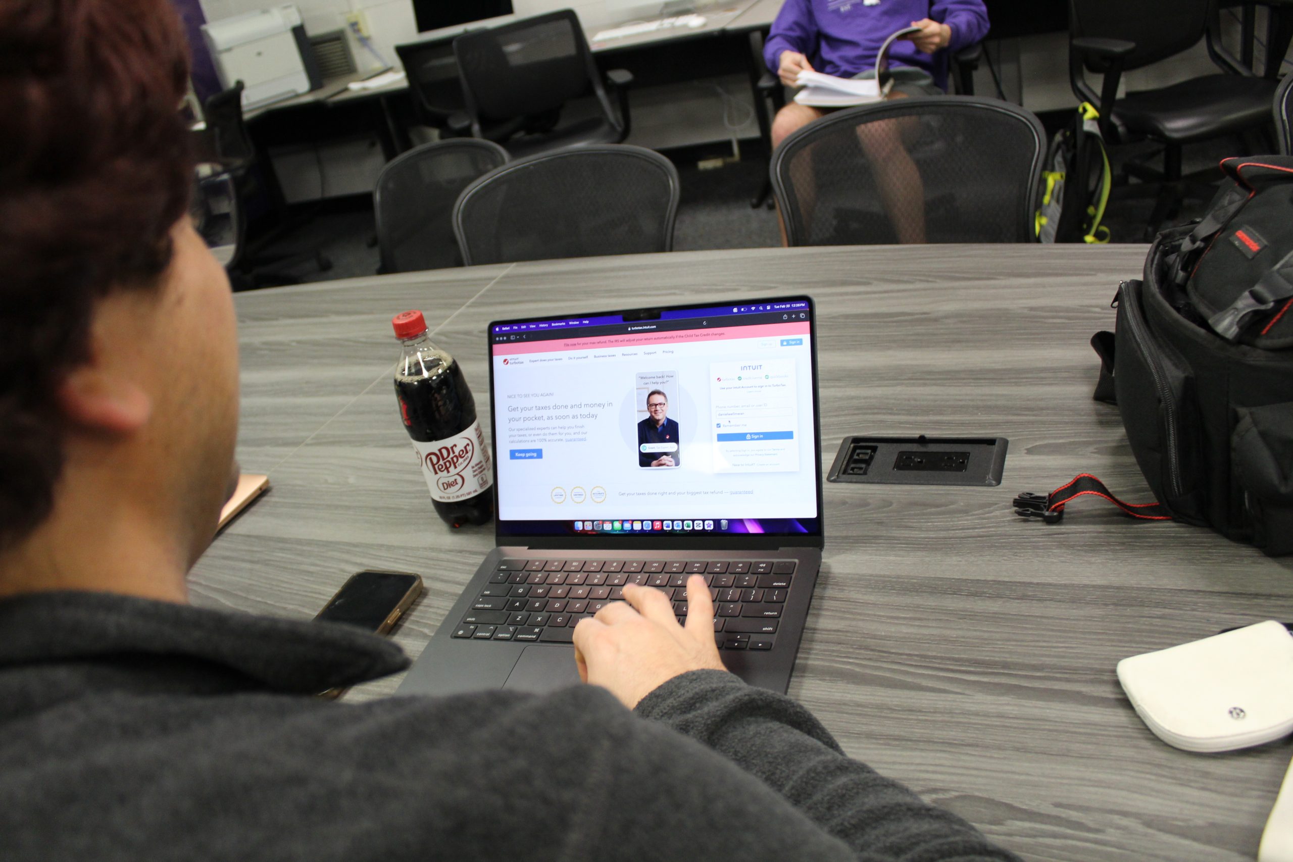 Student Danny Wellmeier does his taxes online in class in hopes that his student peers can help him.