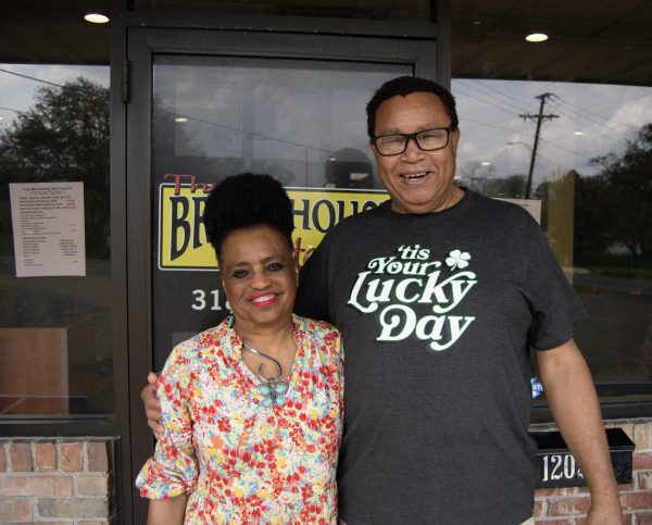 Denise Bradley and Harry Hymes, owners of The Breadhouse-Nakatosh, happily pose in front of their restaurant.