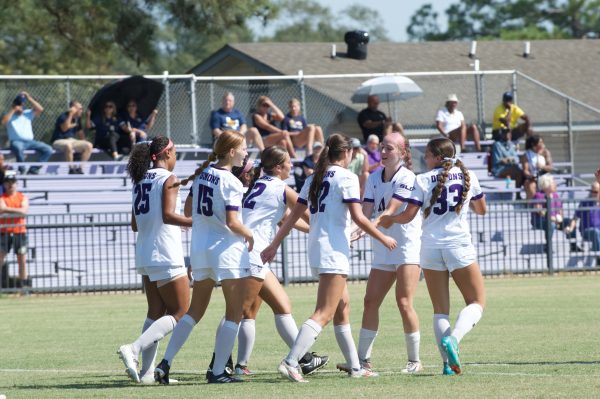 Lady Demons' Dawson Marrs (33), sophomore midfielder and forward, scores against the Texas A&M University-Commerce Lions. 