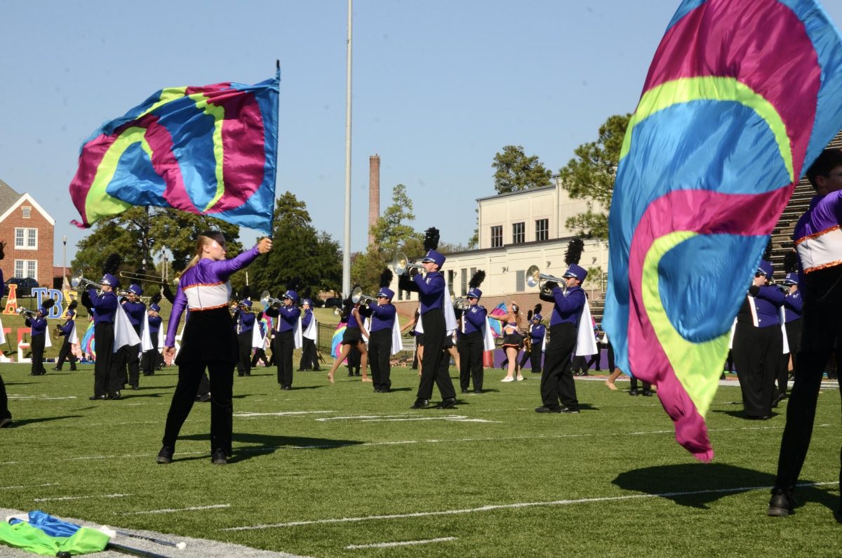 The Spirit of Northwestern takes the field to perform its half-time show before the football crowd. 