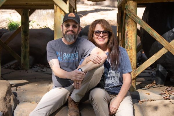 Jason Summerlin (left) and Mardy Summerlin (right) sit on their brand new, soon-to-be-opened Buccaneer Bayou Adventure Mini Golf course.