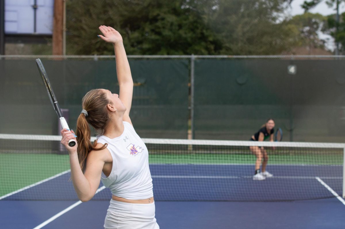 Zoi Spyrou serves as she competes in a single match.