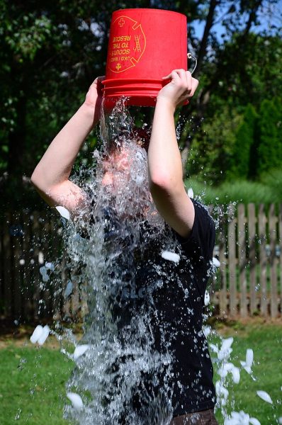 Photo of someone doing the ALS ice bucket challenge in 2014.
