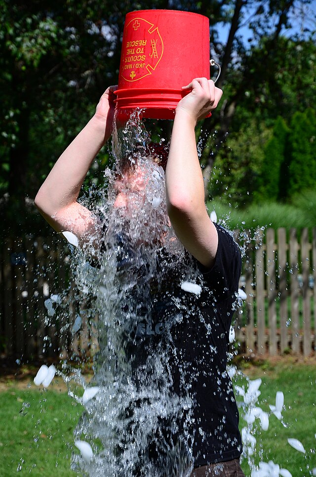 Photo of someone doing the ALS ice bucket challenge in 2014.