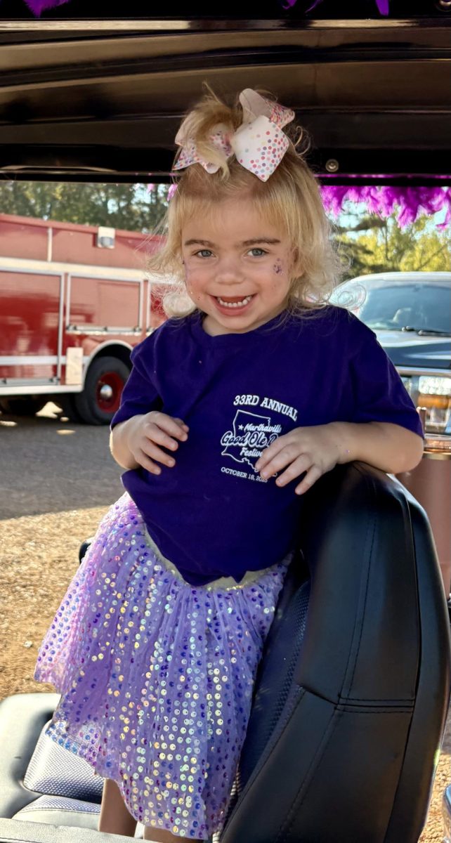 Lydia wearing purple, the official Sanfilippo syndrome awareness color.