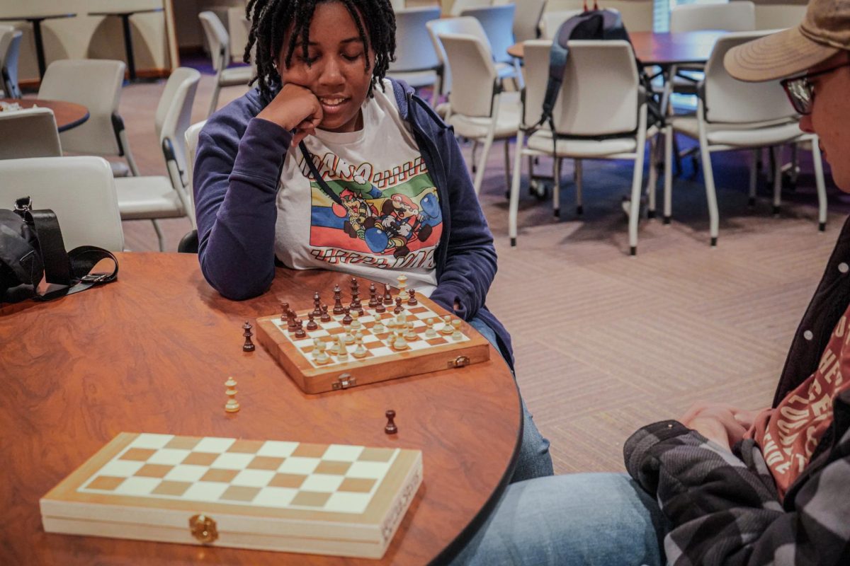 Students play and practice their chess skills at the chess team's weekly meeting.