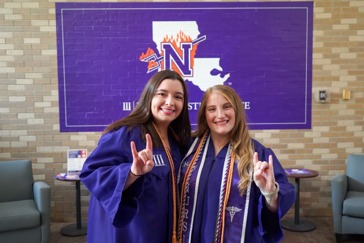 Gabrielle Simon and Karley Martinez head to Grad Fest at the NSU Alexandria campus.