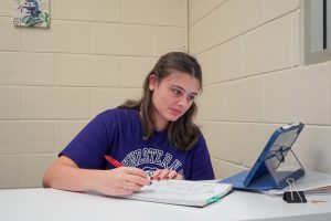 Student Madelyn Ackal works at her on campus job. 